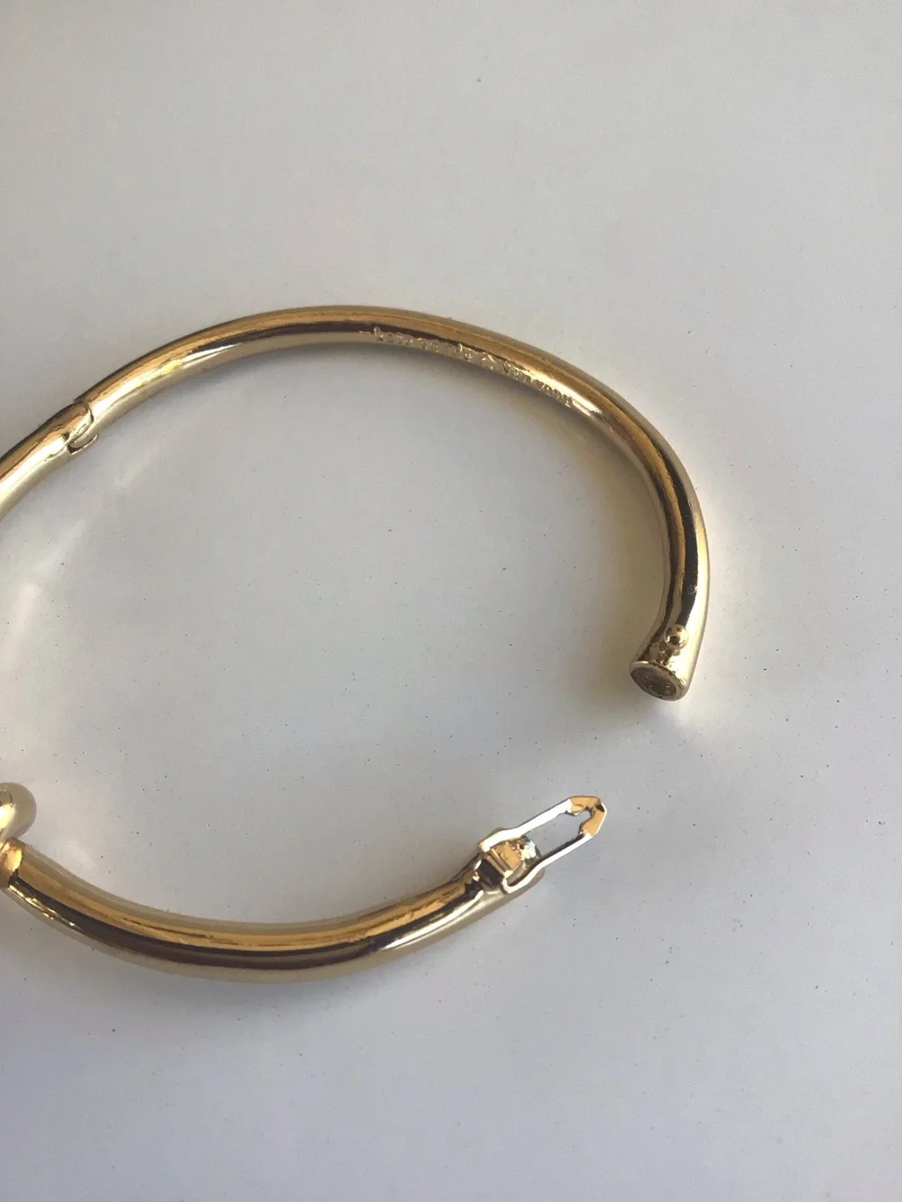 Kate Spade gold knot bangle bracelet